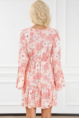 the back of a woman's dress with a floral print