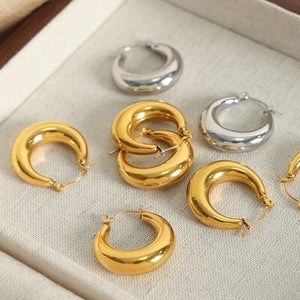 six pairs of gold and silver hoop earrings