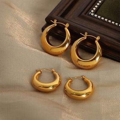 three pairs of shiny gold hoop earrings