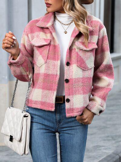 a woman wearing a pink and white plaid jacket