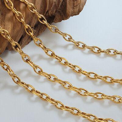a close up of a chain on a piece of wood