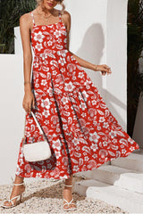 a woman in a red and white floral print dress