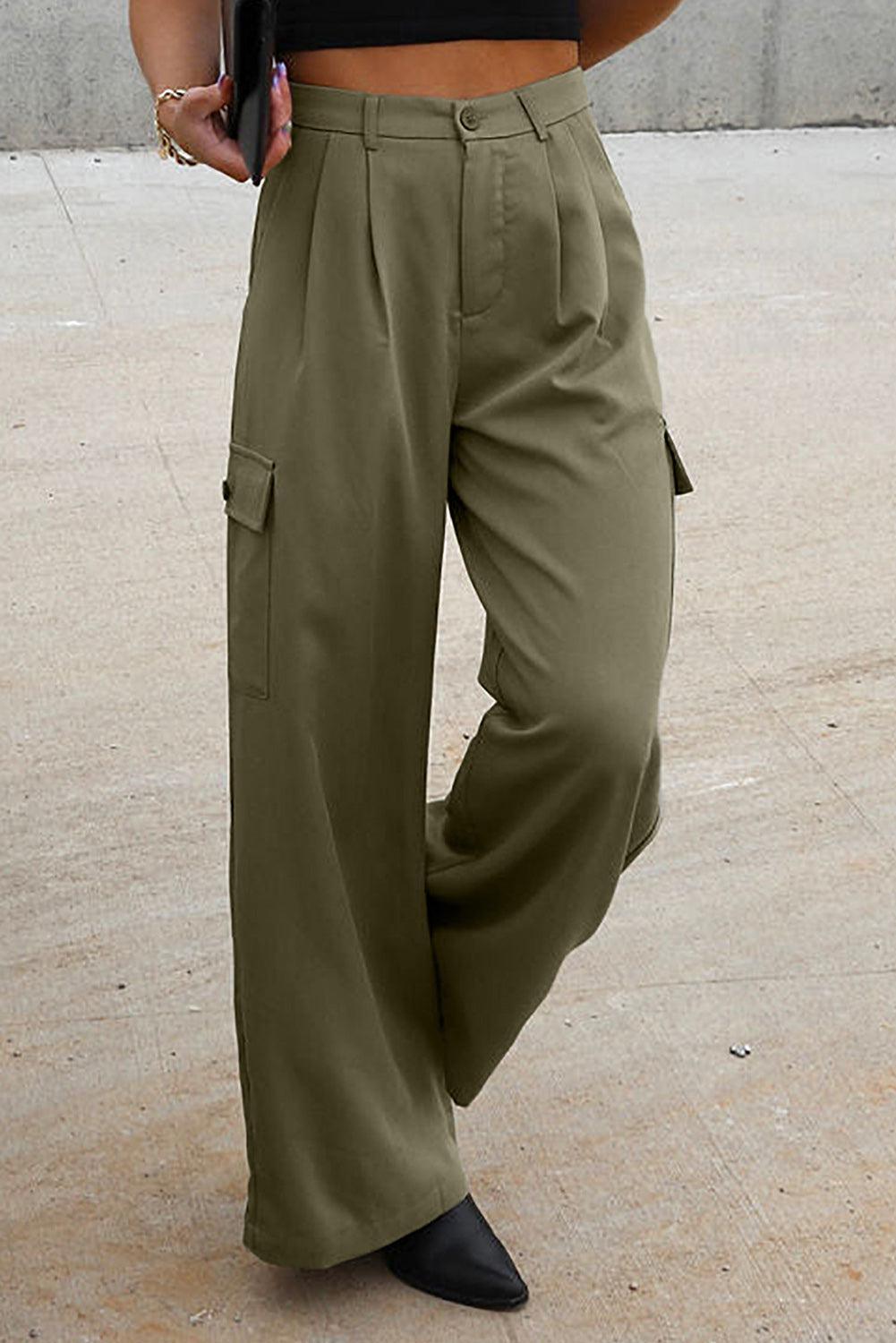 a woman in a black top and khaki pants