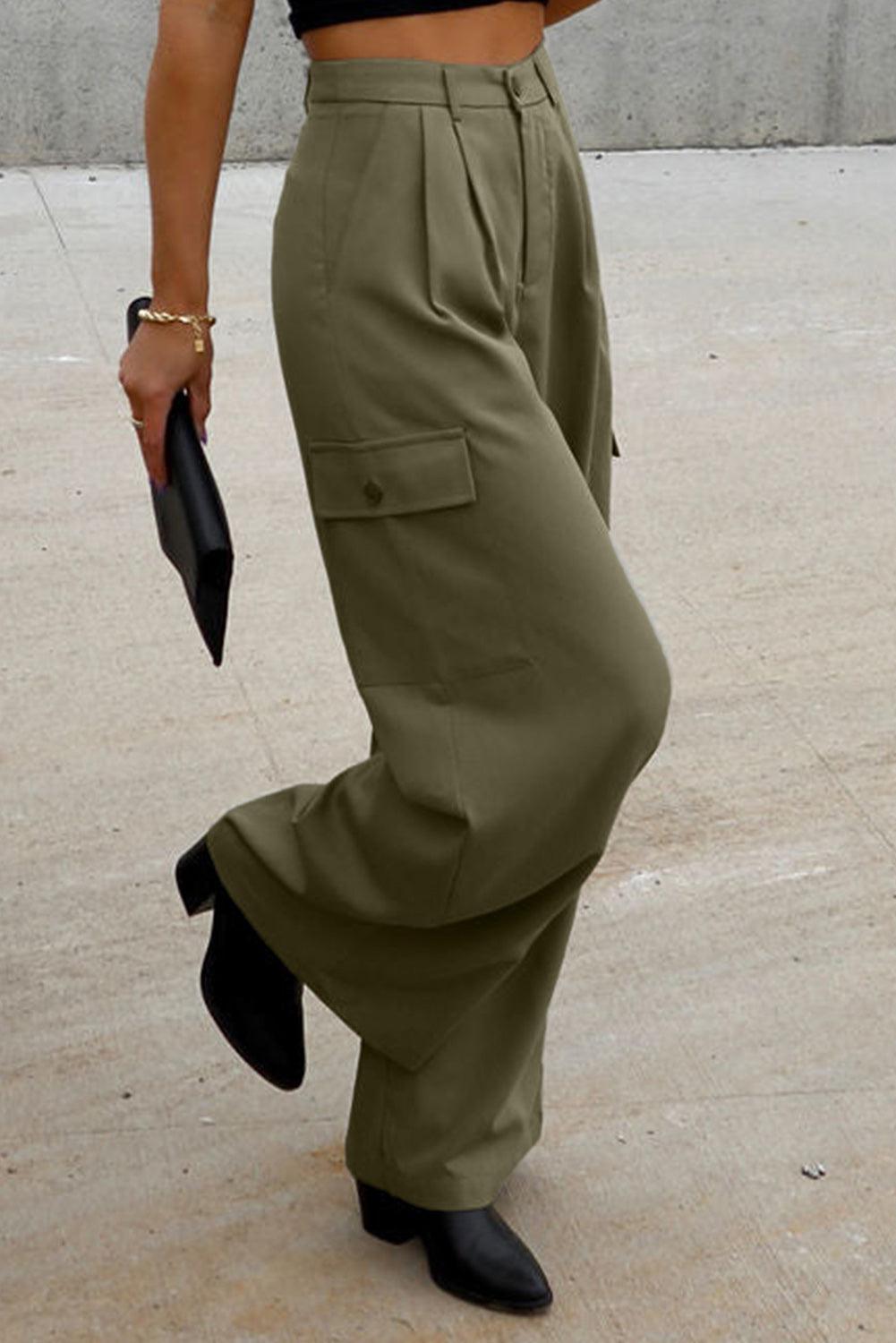 a woman in a black top and khaki pants