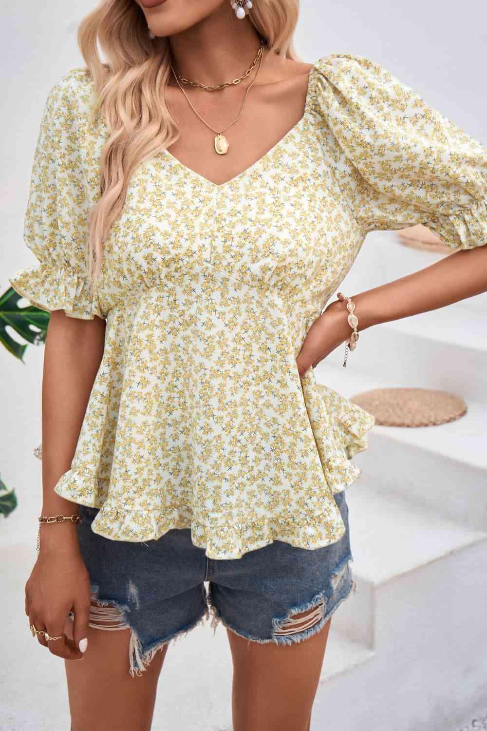 a woman wearing a yellow floral top