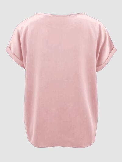 a women's pink top with short sleeves