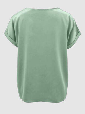 a women's green top with short sleeves
