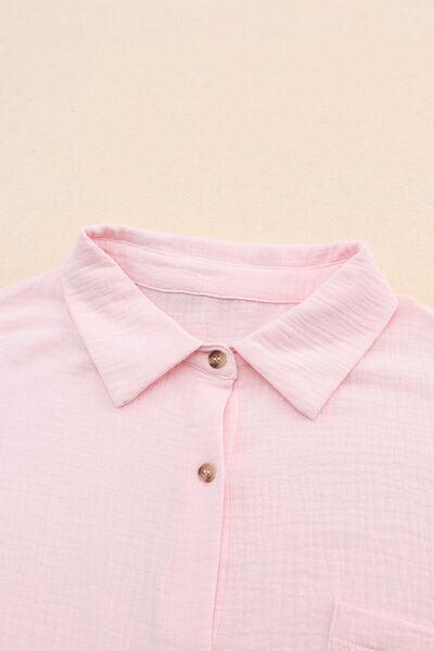 a close up of a pink shirt with buttons