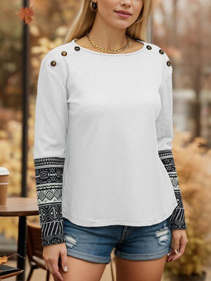 a beautiful blond woman standing in front of a table