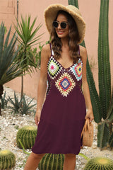 a woman standing in front of a cactus