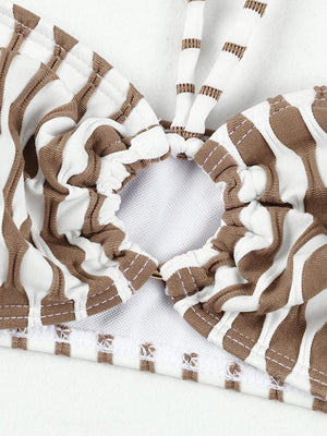 a close up of a brown and white bikini top