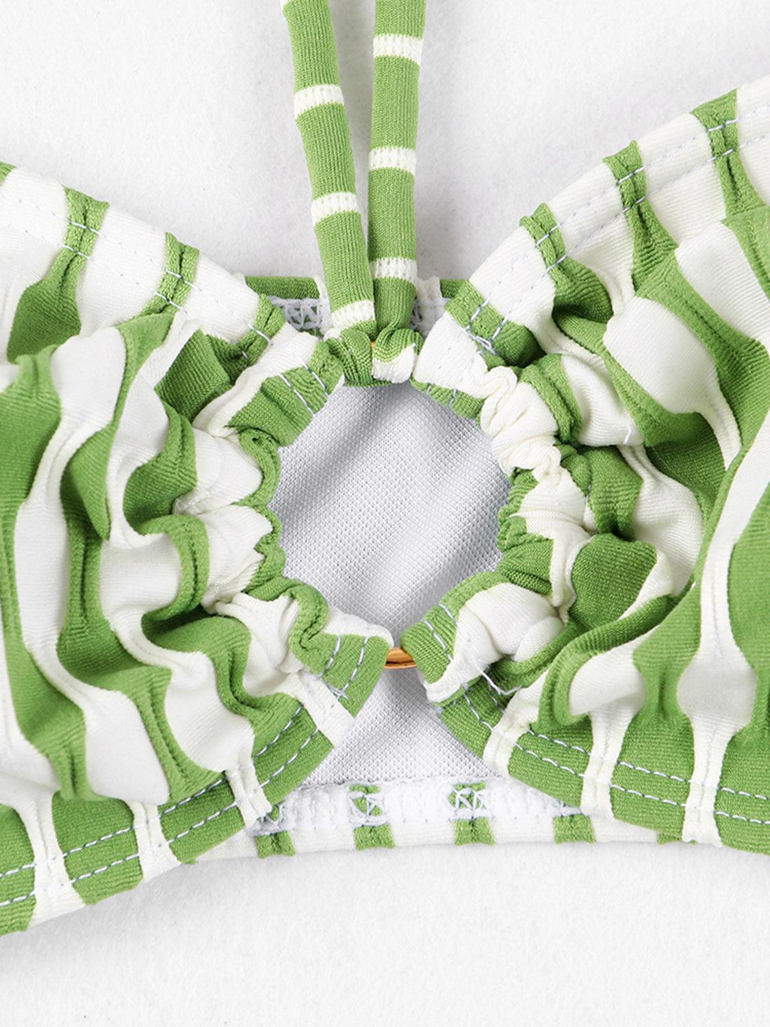a close up of a green and white bikini top