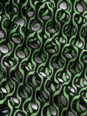a close up of a black and green fabric