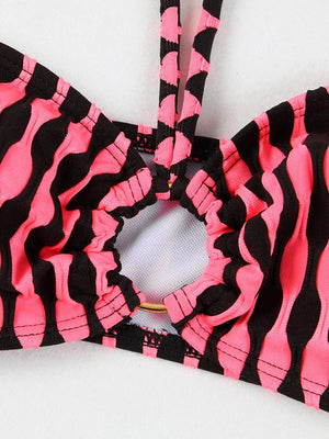 a close up of a pink and black bra