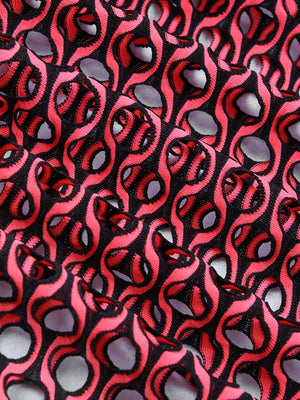 a close up of a red and black fabric