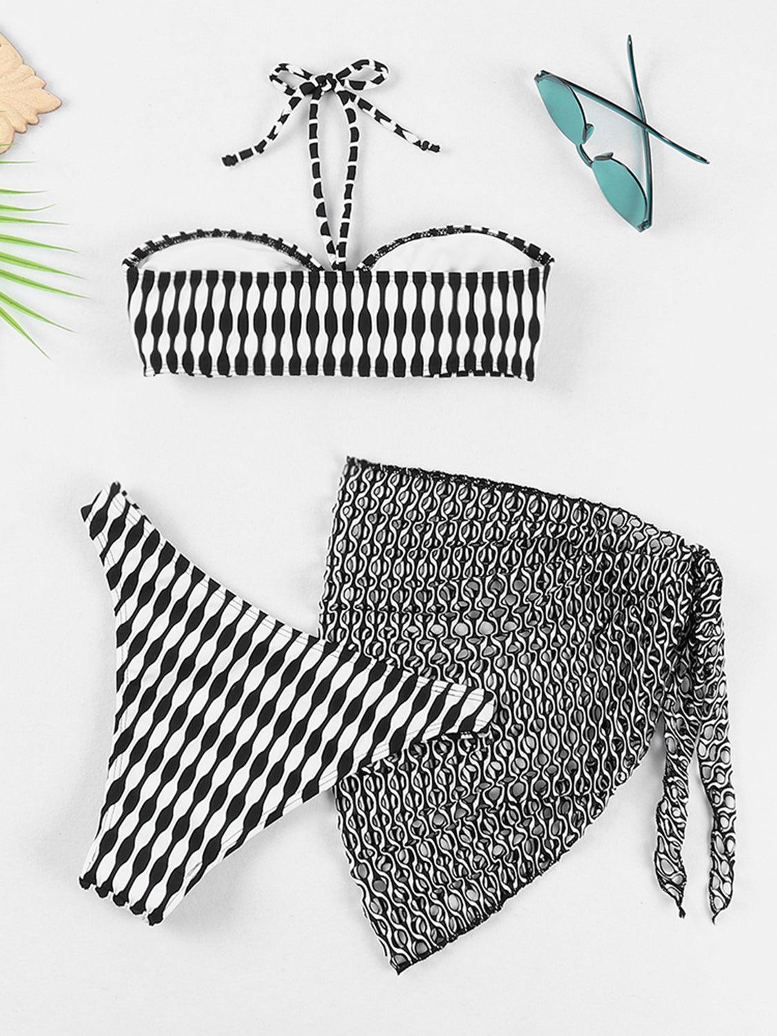 a pair of black and white bikinis and a pair of sunglasses