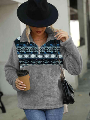 a woman walking down a street while holding a cup of coffee