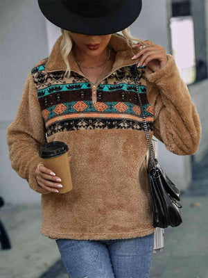 a woman walking down a street while holding a cup of coffee