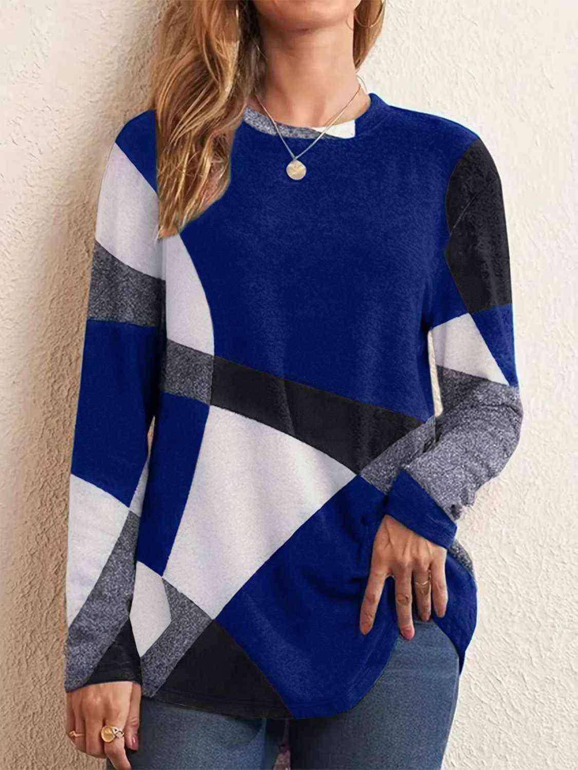 a woman wearing a blue and white sweater