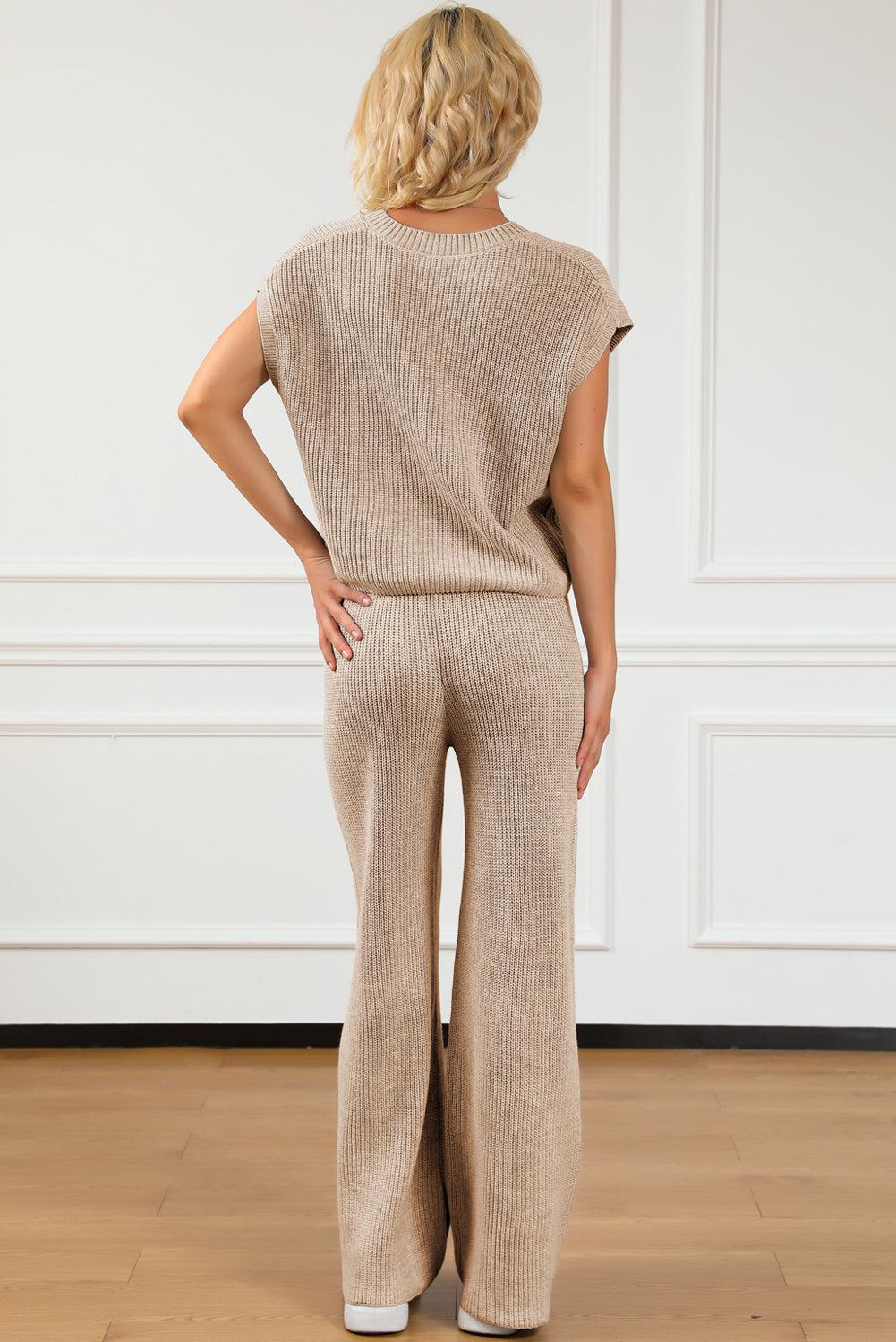 a woman in a tan sweater and pants