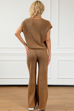 a woman in a brown sweater and pants