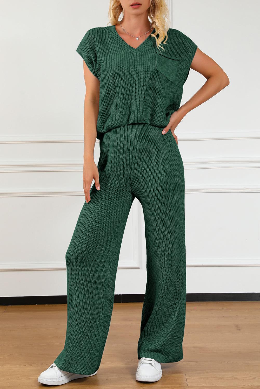 a woman in a green jumpsuit posing for the camera