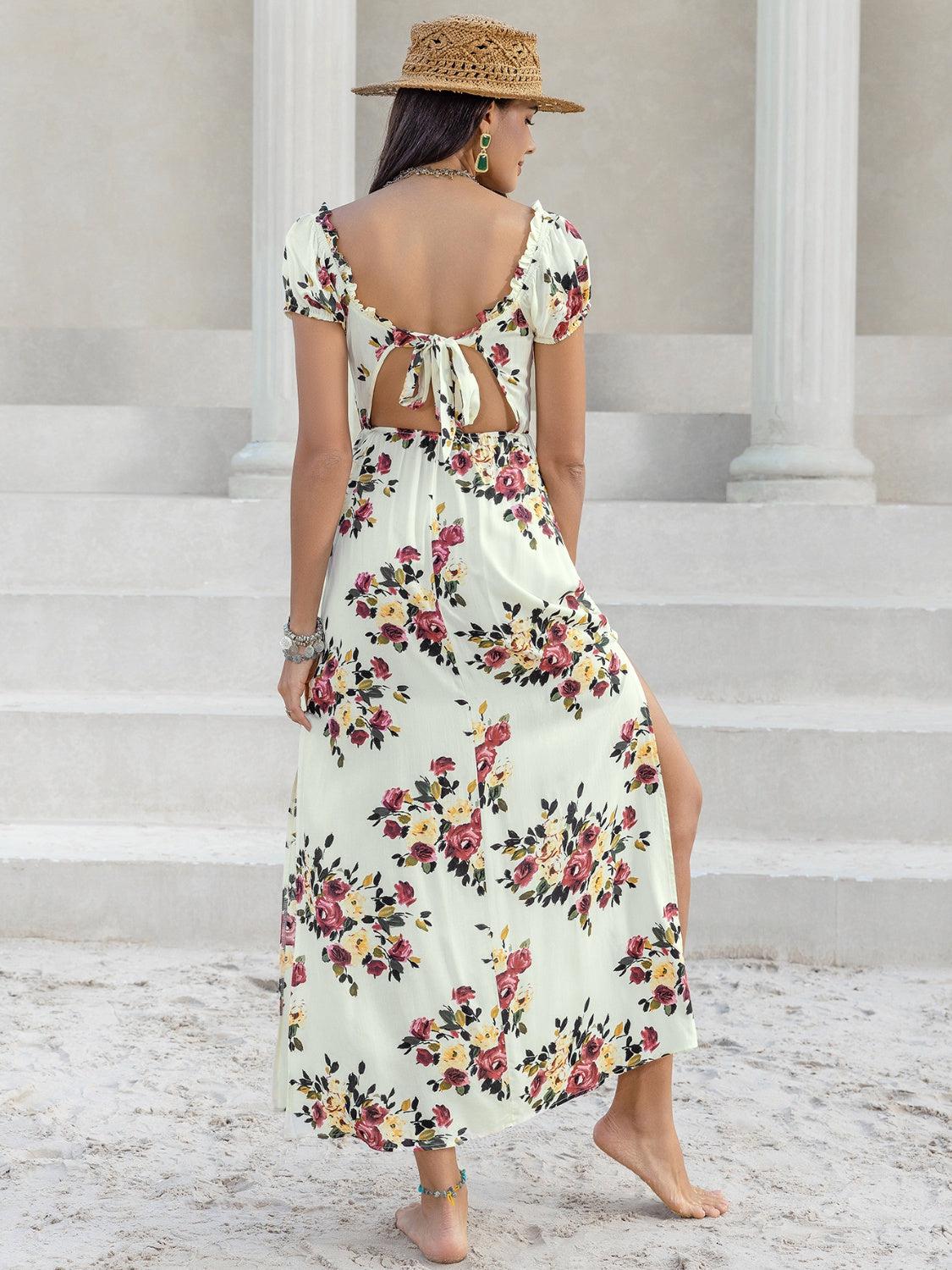 a woman wearing a floral dress and a straw hat