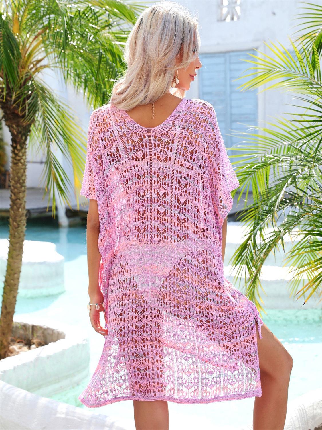 a woman wearing a pink crochet cover up