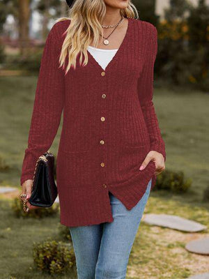 a woman wearing a red sweater and jeans