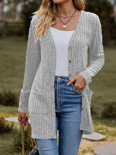 a woman wearing a cardigan sweater and jeans