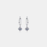 a pair of earrings on a white background