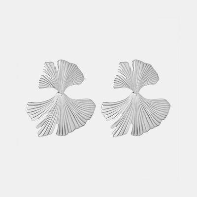 a pair of earrings with a fan shaped design