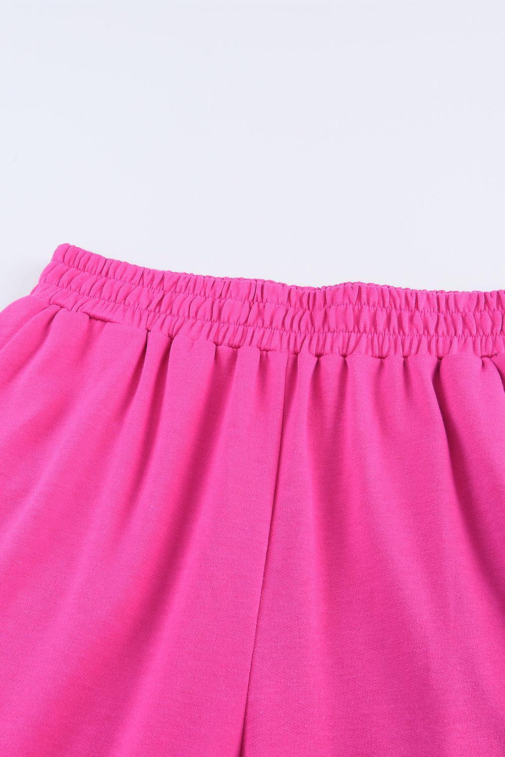 a close up of a pink shorts on a white background