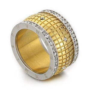 a gold and silver ring with diamonds