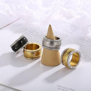 three different types of rings sitting on top of a table