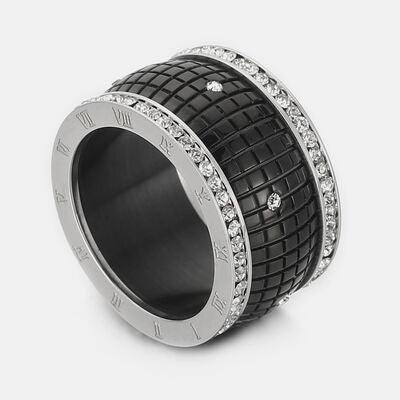 a black and white ring with diamonds on it