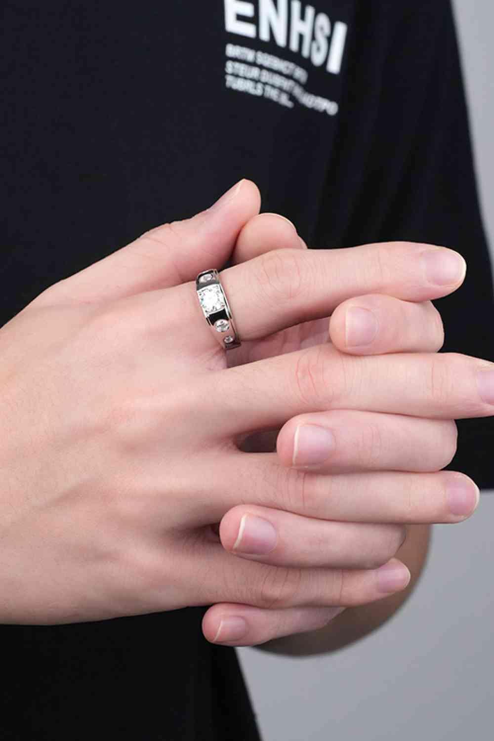 a person with a ring on their hand