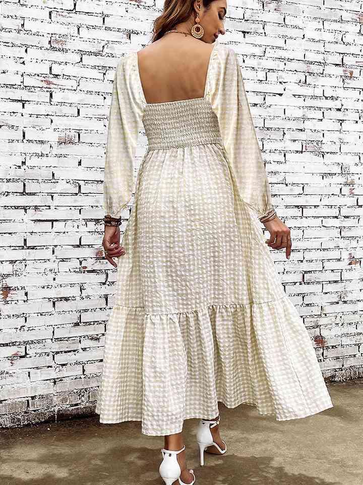 a woman standing in front of a brick wall