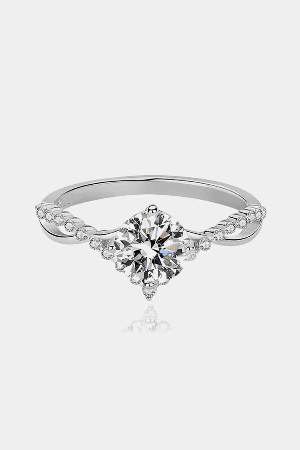 a diamond engagement ring with a twisted band