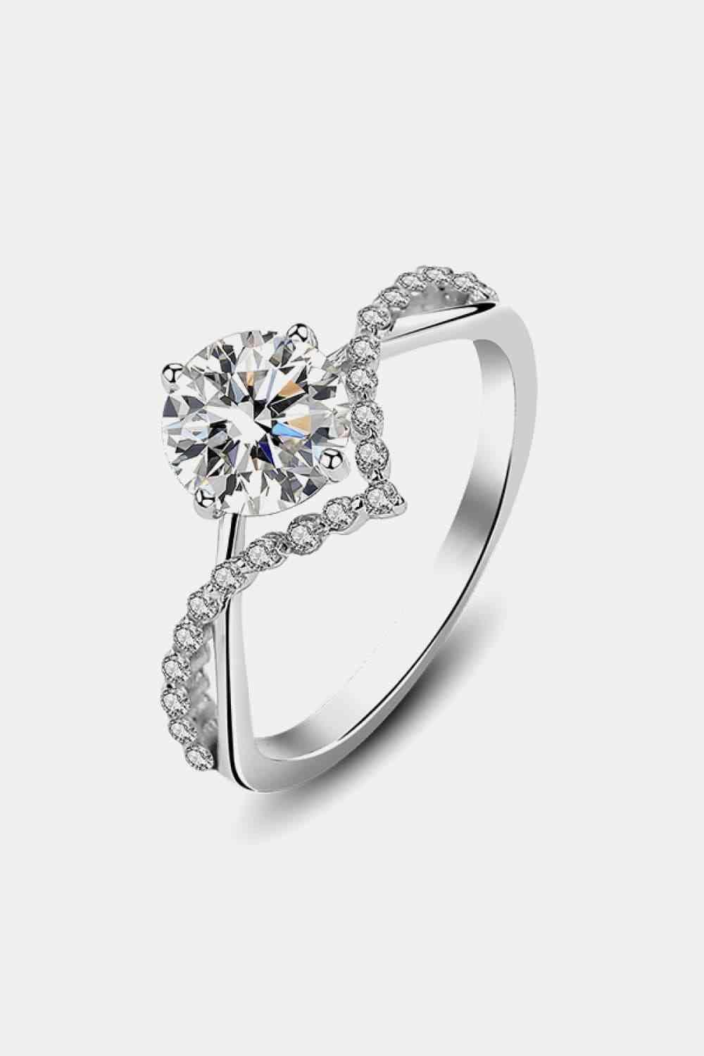 a white gold ring with a diamond in the center