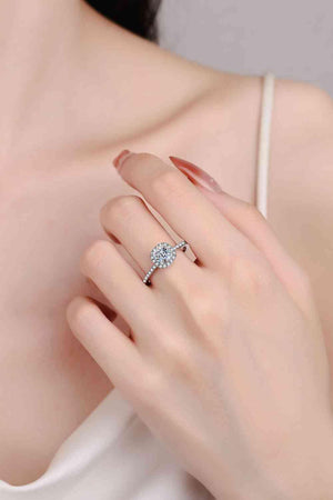 a woman's hand with a diamond ring on it