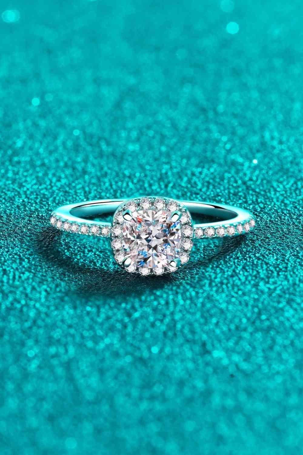 a diamond ring on a blue background