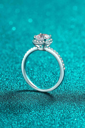 a close up of a diamond ring on a blue background