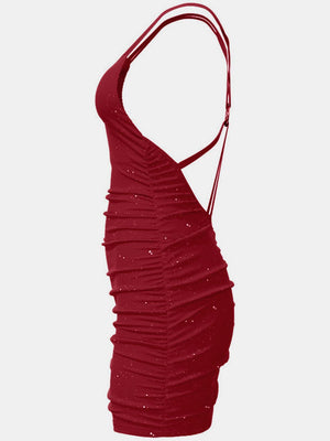 a woman's red dress with ruffles on it