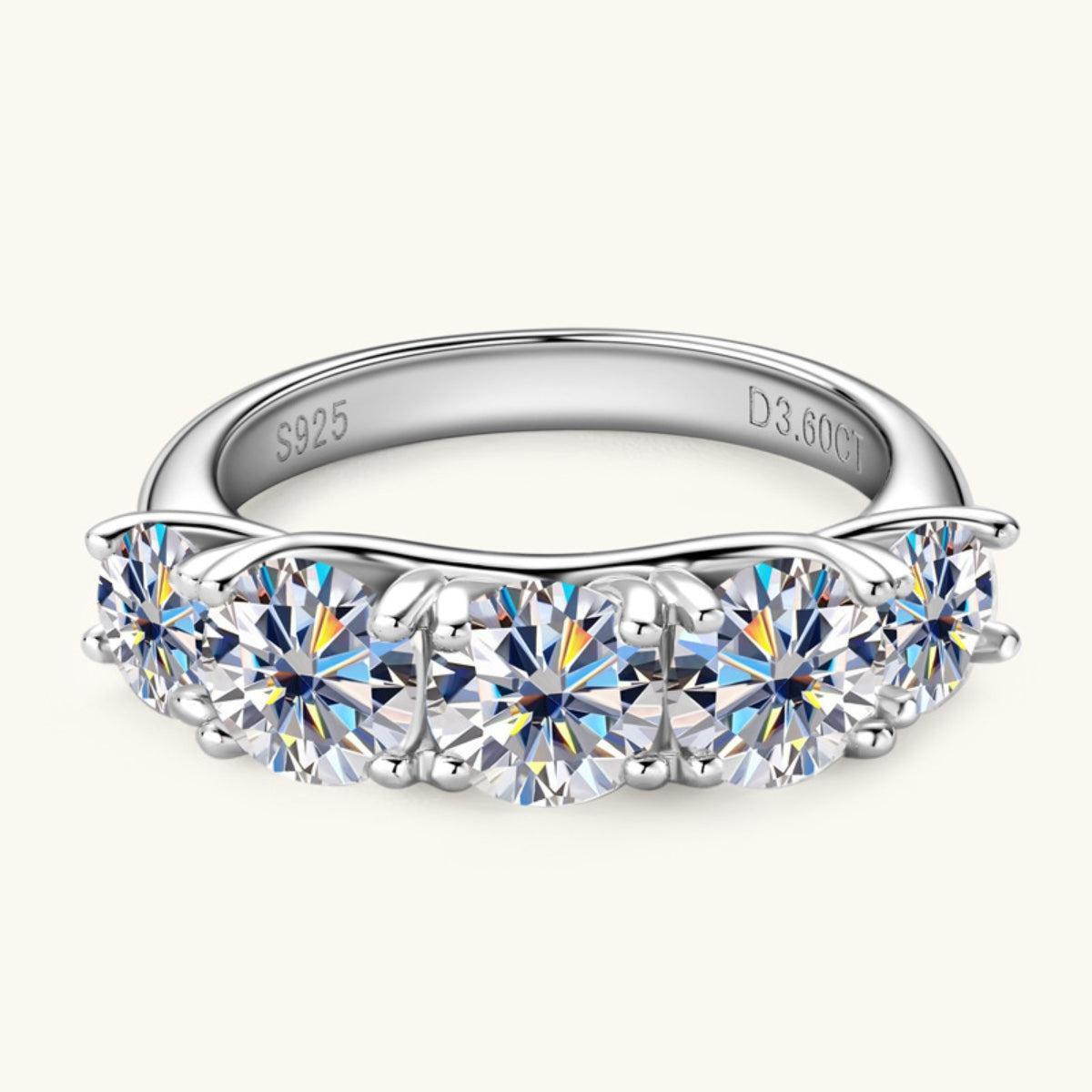 a diamond ring with five stones on it