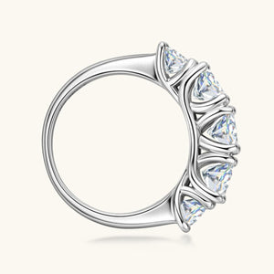 a white gold ring with four pear shaped diamonds