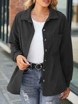 a woman wearing a black jacket and jeans