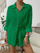 a woman wearing a green shirt and shorts