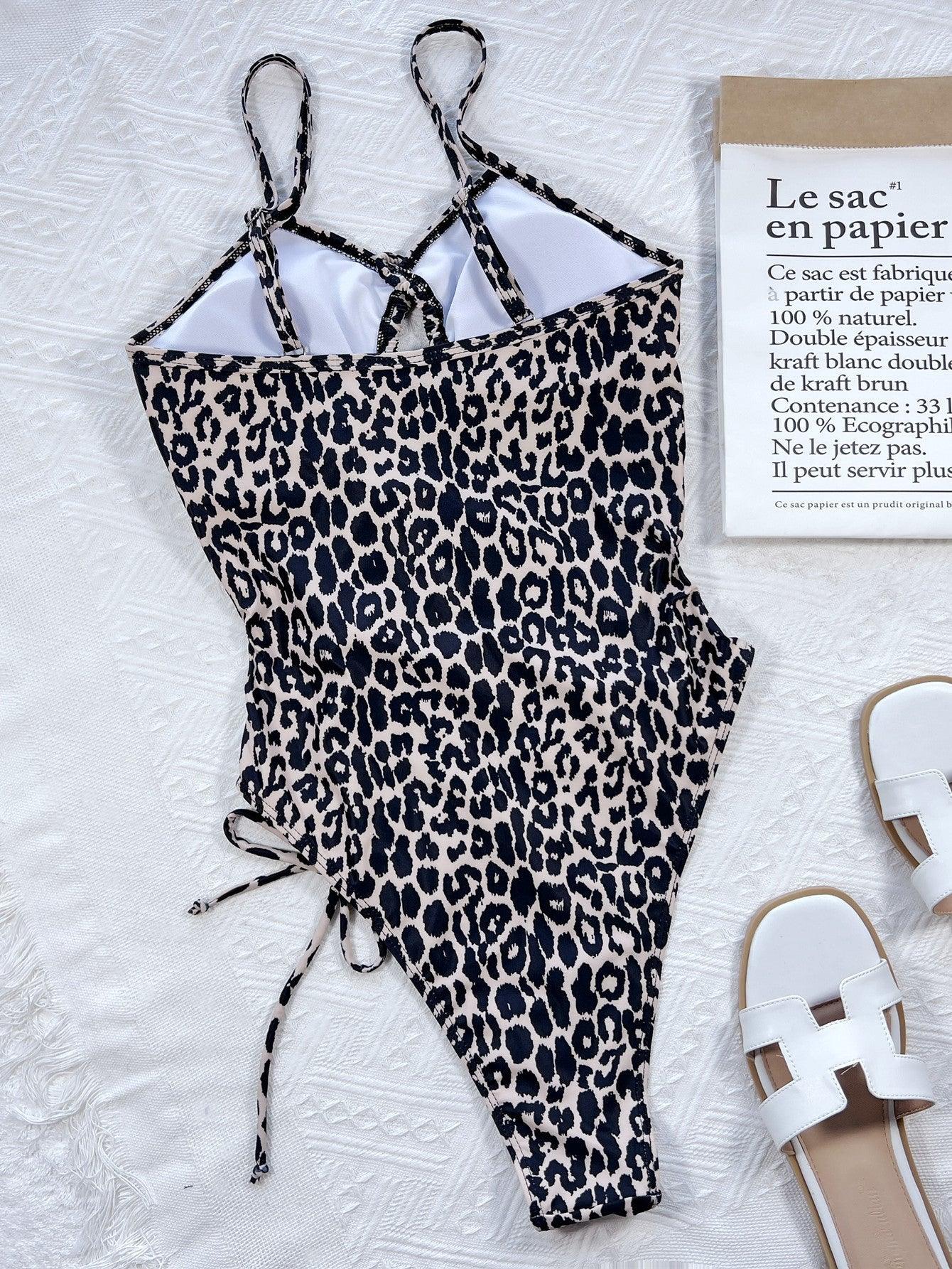 a bathing suit and sandals on a bed