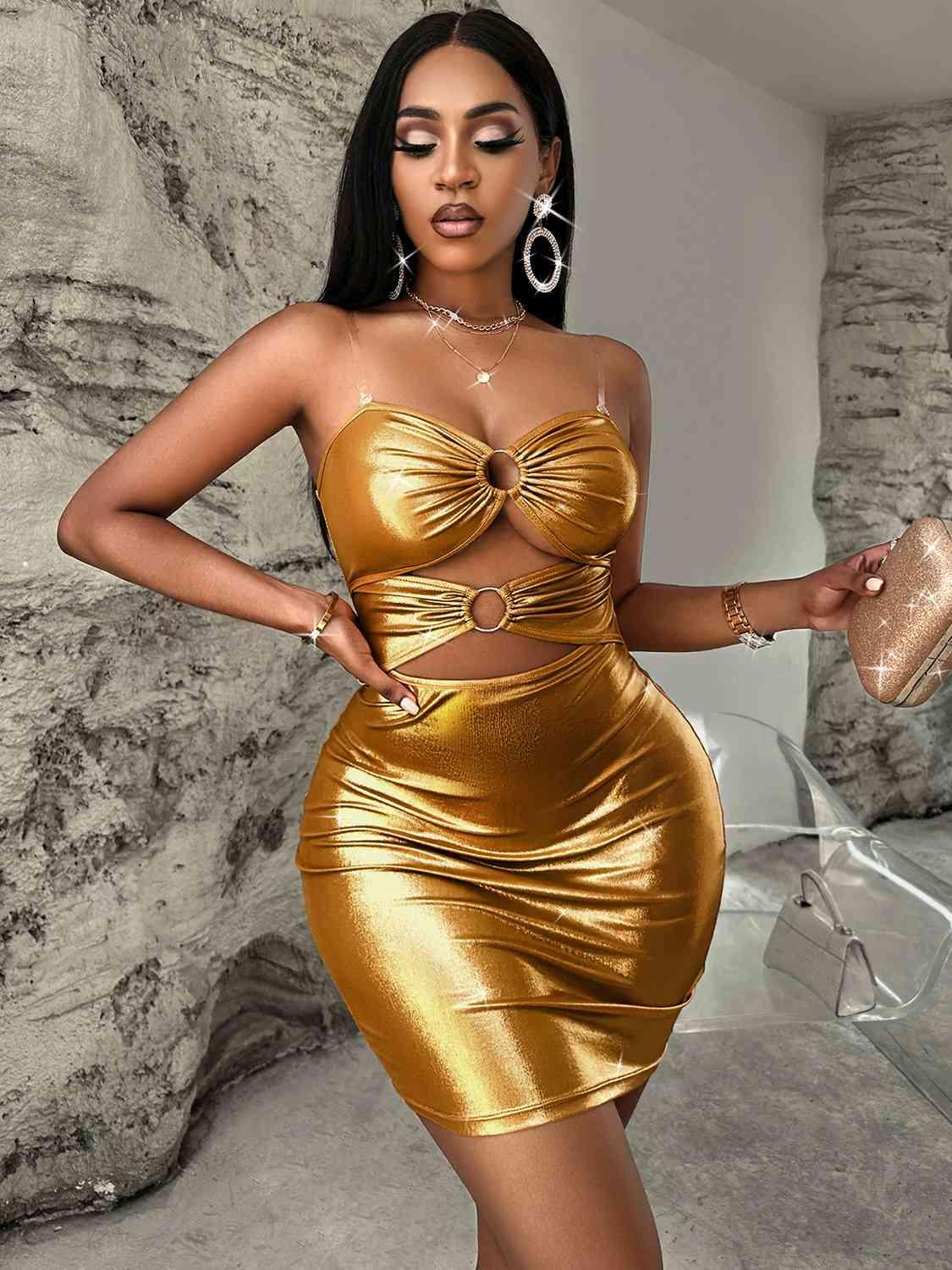 a woman in a gold dress